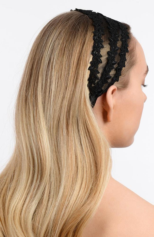 Wide headband made of black lace and mesh pictured holding back blonde hair. Headband by L. Erickson