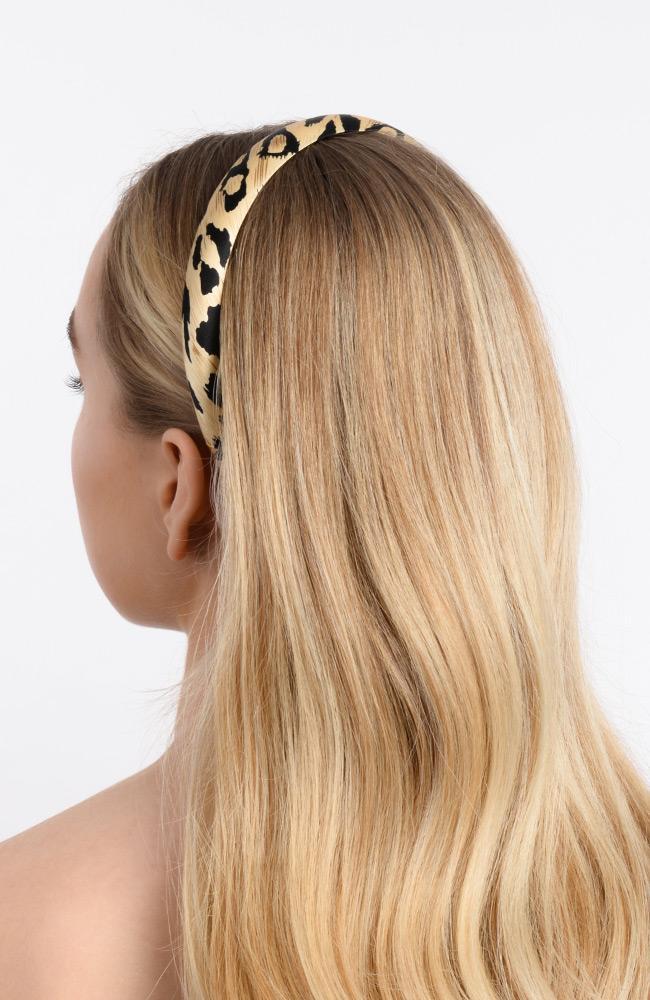Cheeta print silk headband holding back blonde hair