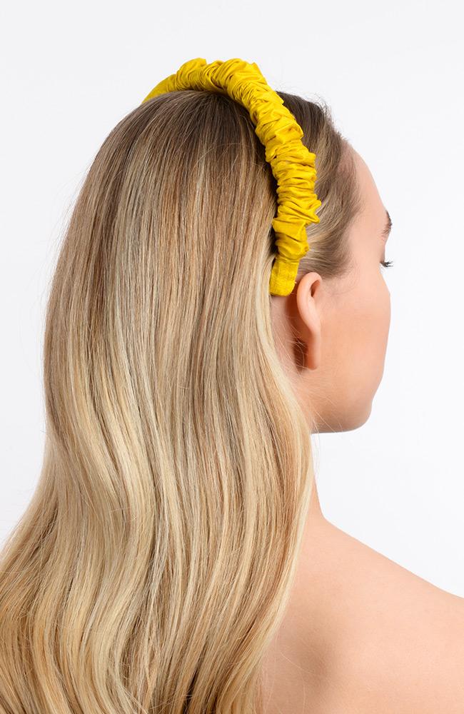 Yellow rouched headband on blonde straight hair