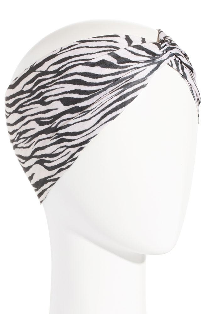 Wide headband with twist at top. Zebra Print fabric made of soft Italian lycra pictured on mannequin, by L. Erickson